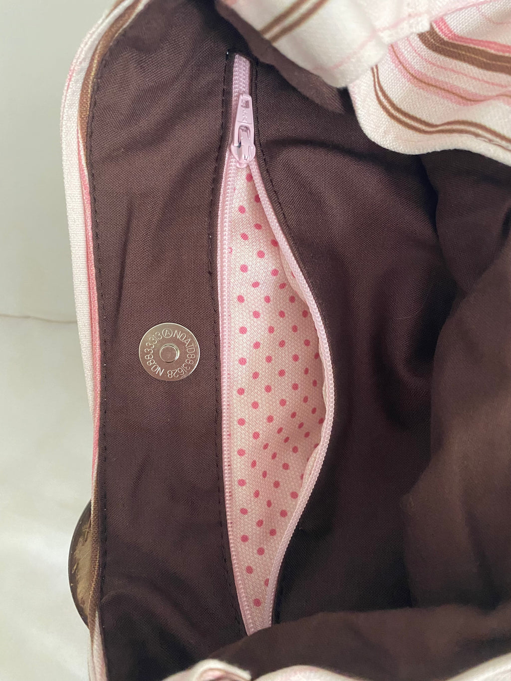 brown & pink striped purse with buckle