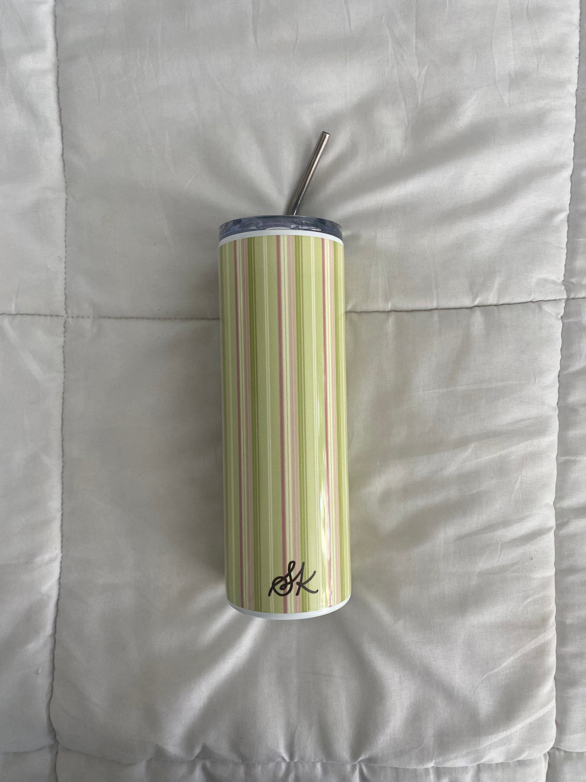 green and pink striped tumbler