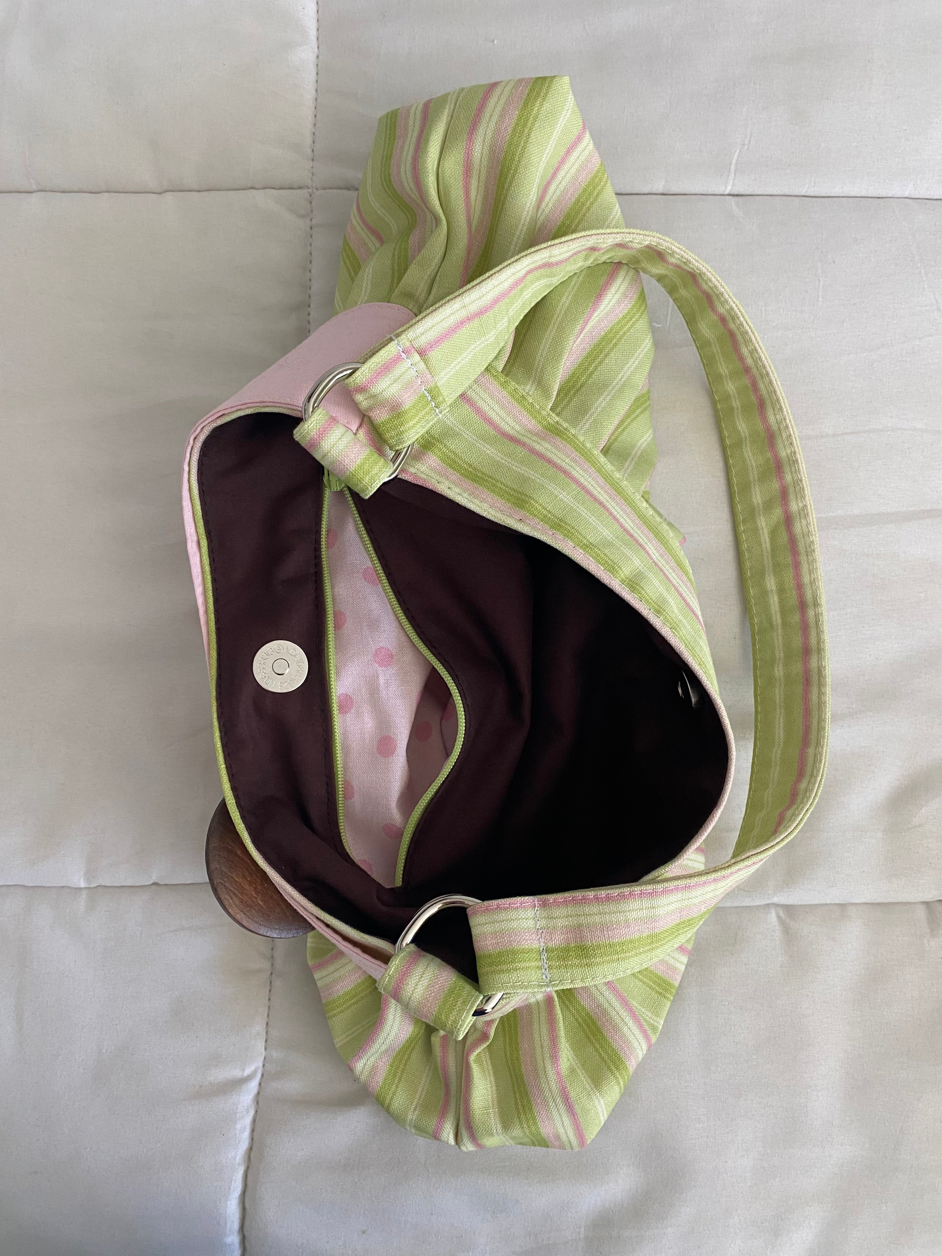 green & pink striped purse with button