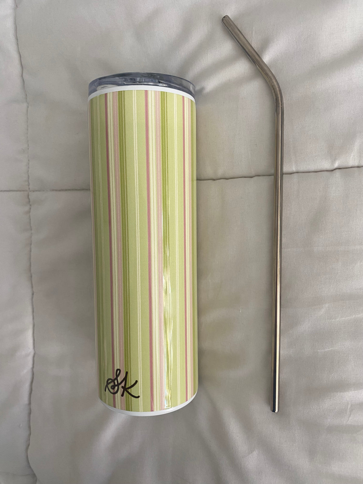 green and pink striped tumbler