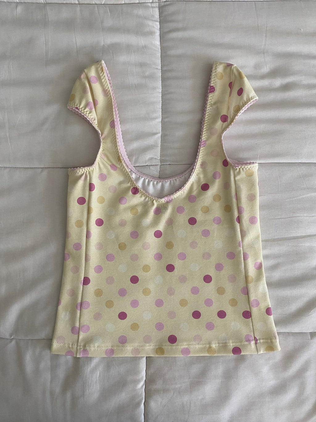 large polka dot top in yellow