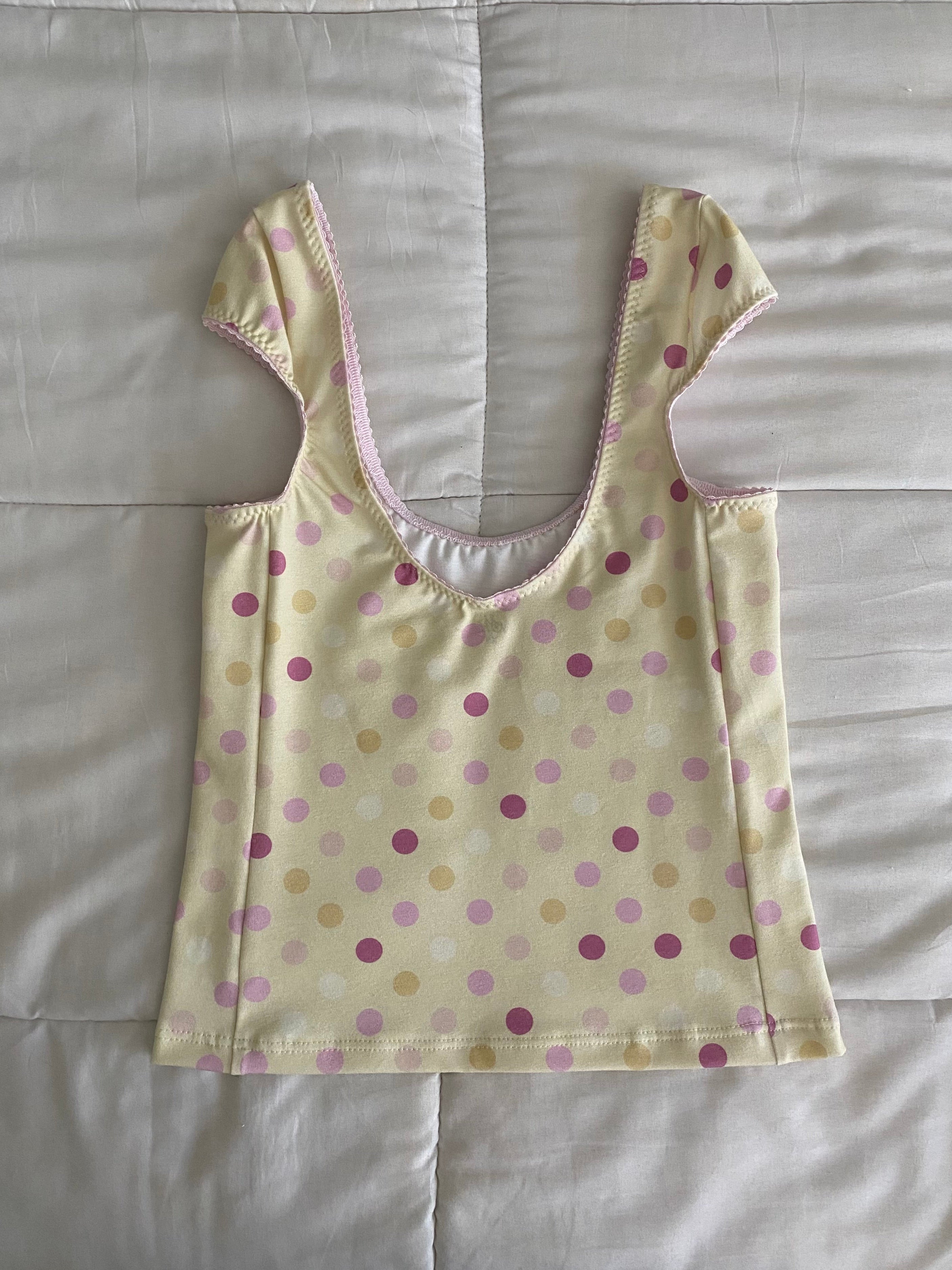 large polka dot top in yellow