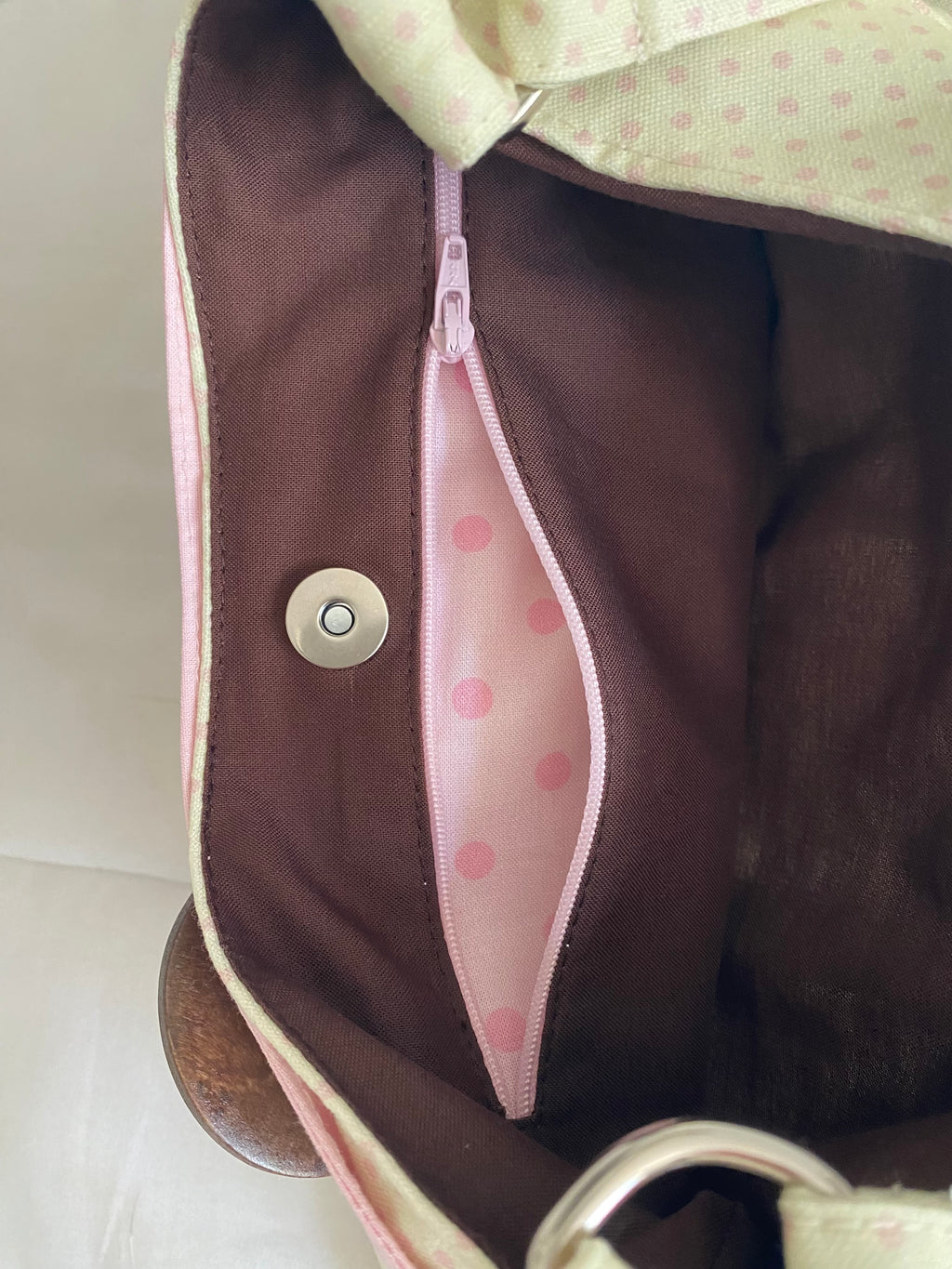 cream & pink polka dot purse with button