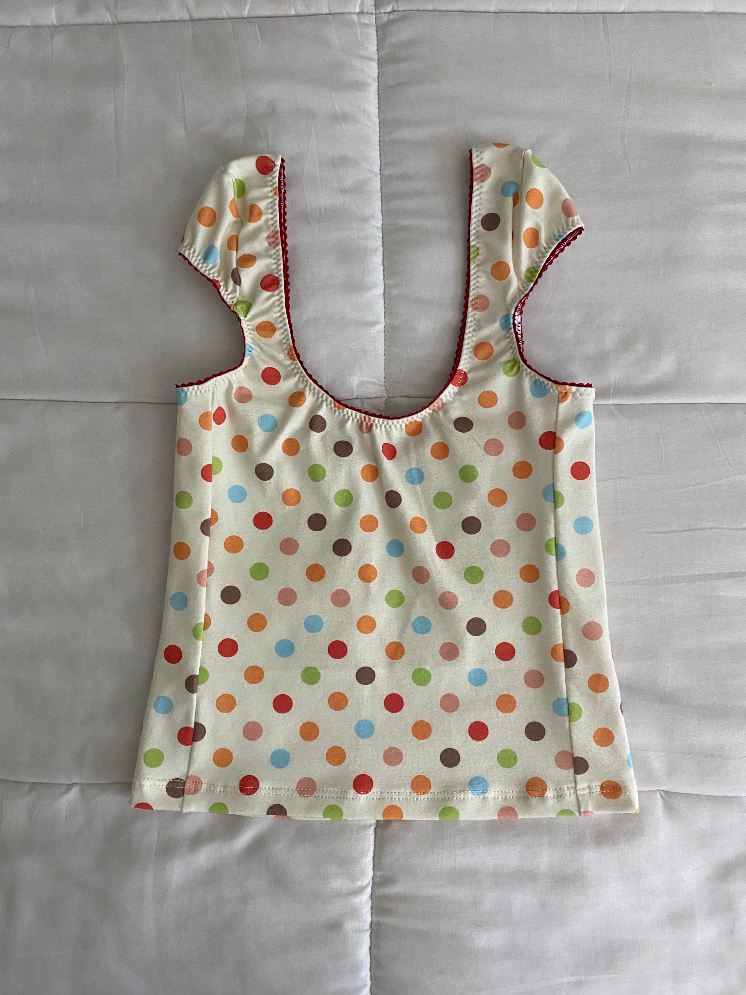 multicolored large polka dot top