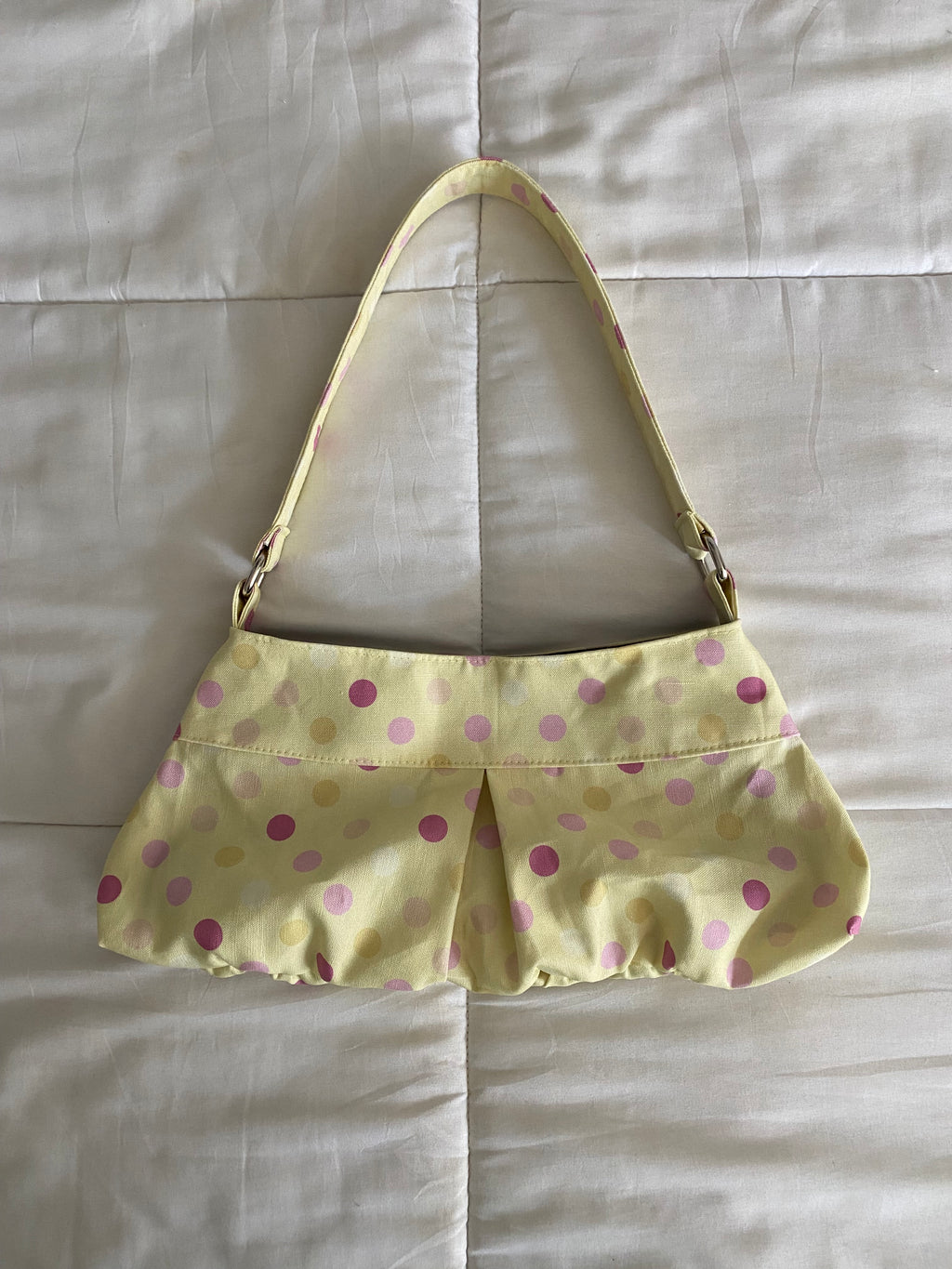 large polka dot purse in yellow