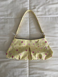 large polka dot purse in yellow