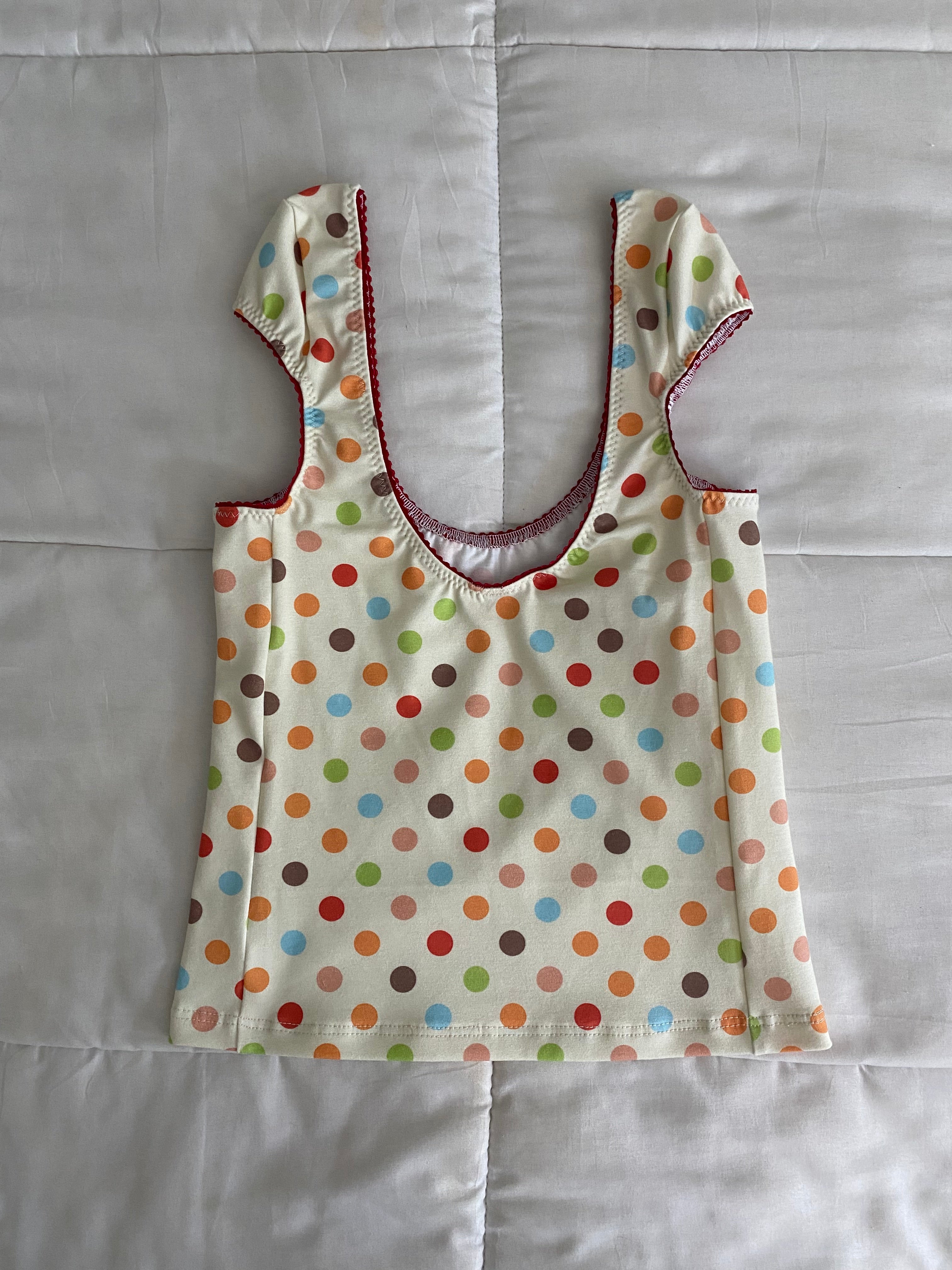 multicolored large polka dot top