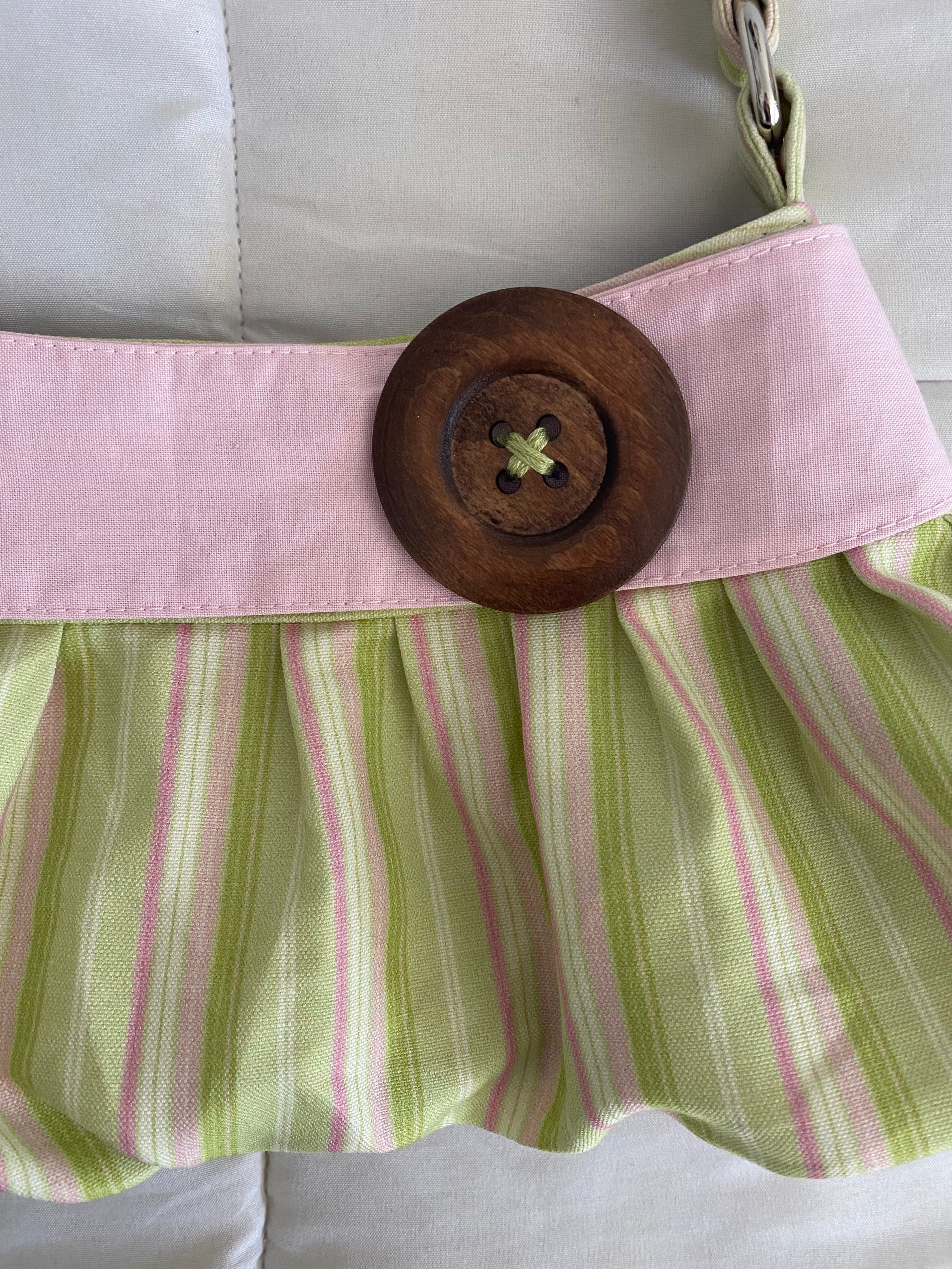 green & pink striped purse with button