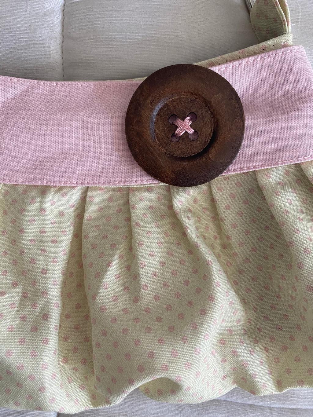 cream & pink polka dot purse with button