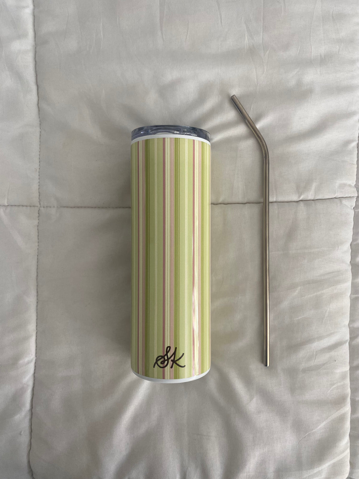 green and pink striped tumbler