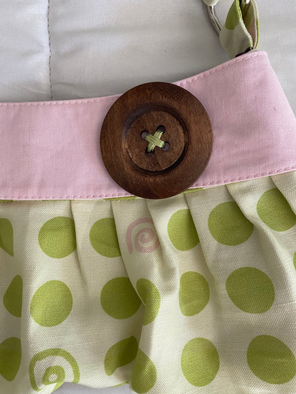 pink & green dotted/swirl purse with button