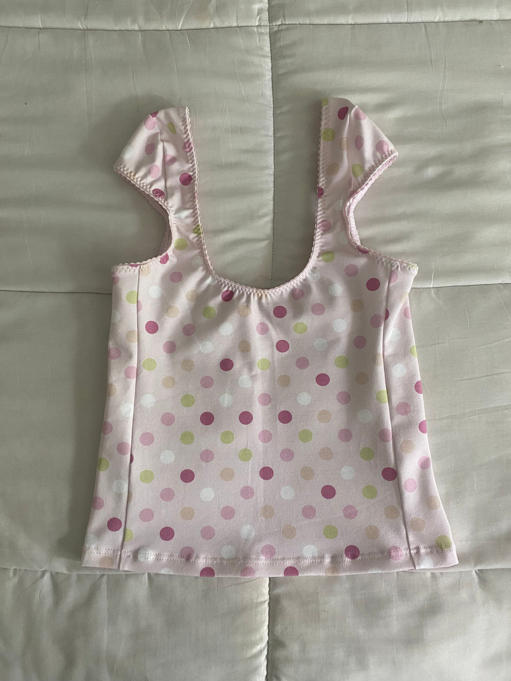large polka dot top in pink