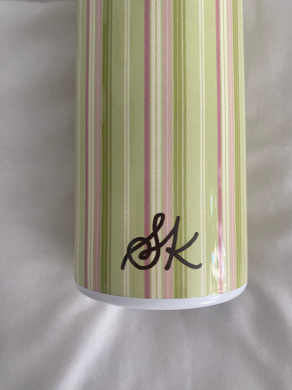 green and pink striped tumbler