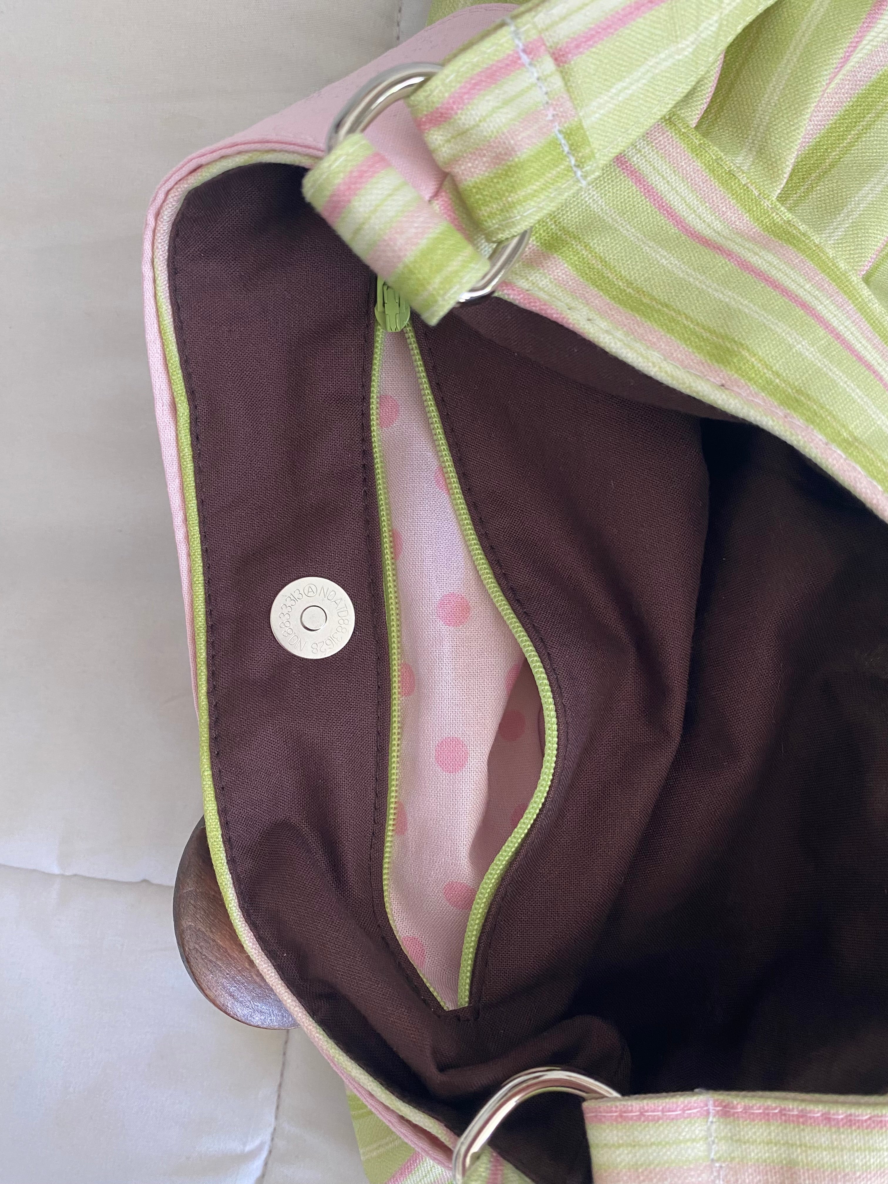 green & pink striped purse with button