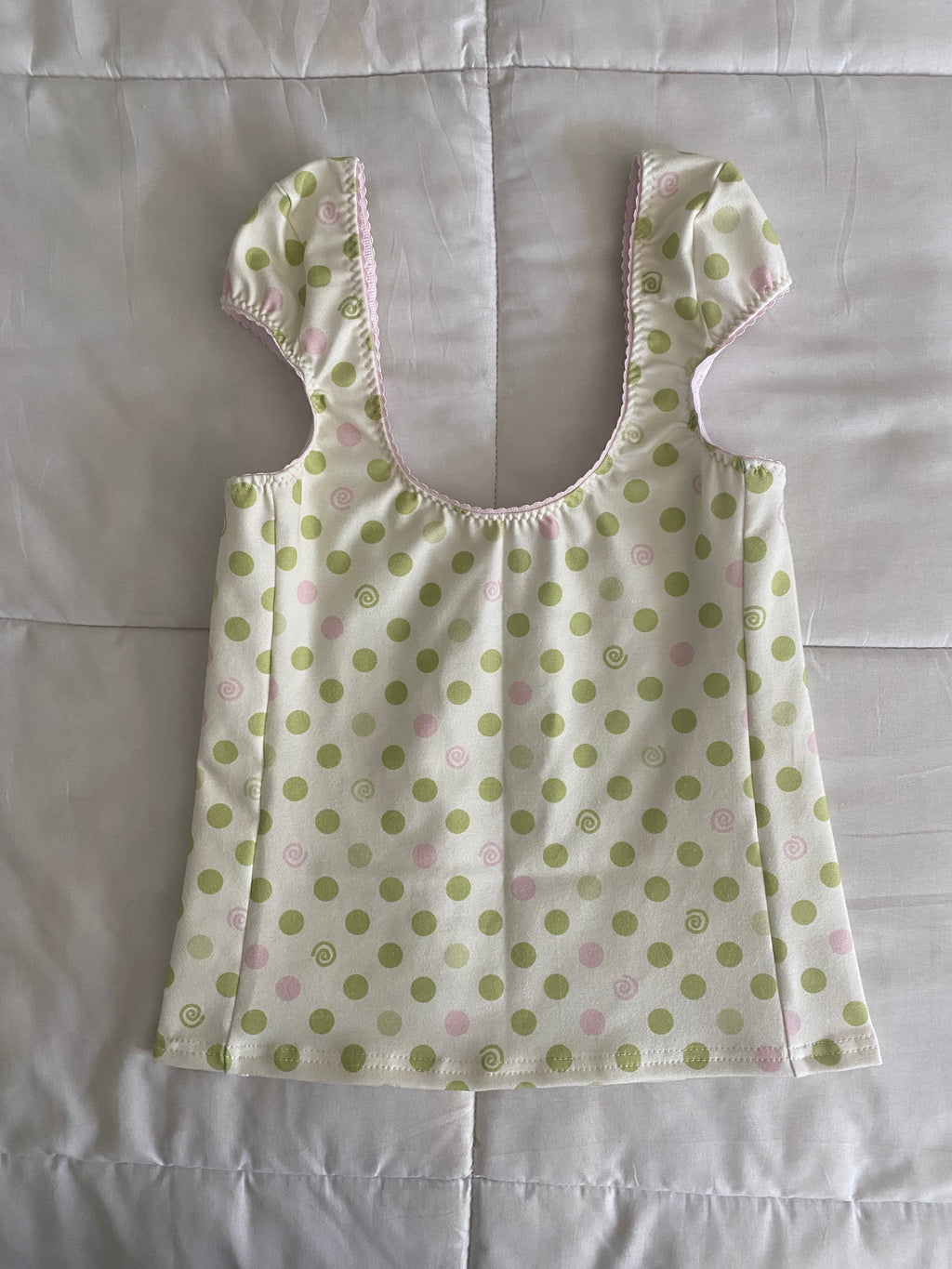 green & pink dotted/swirl top