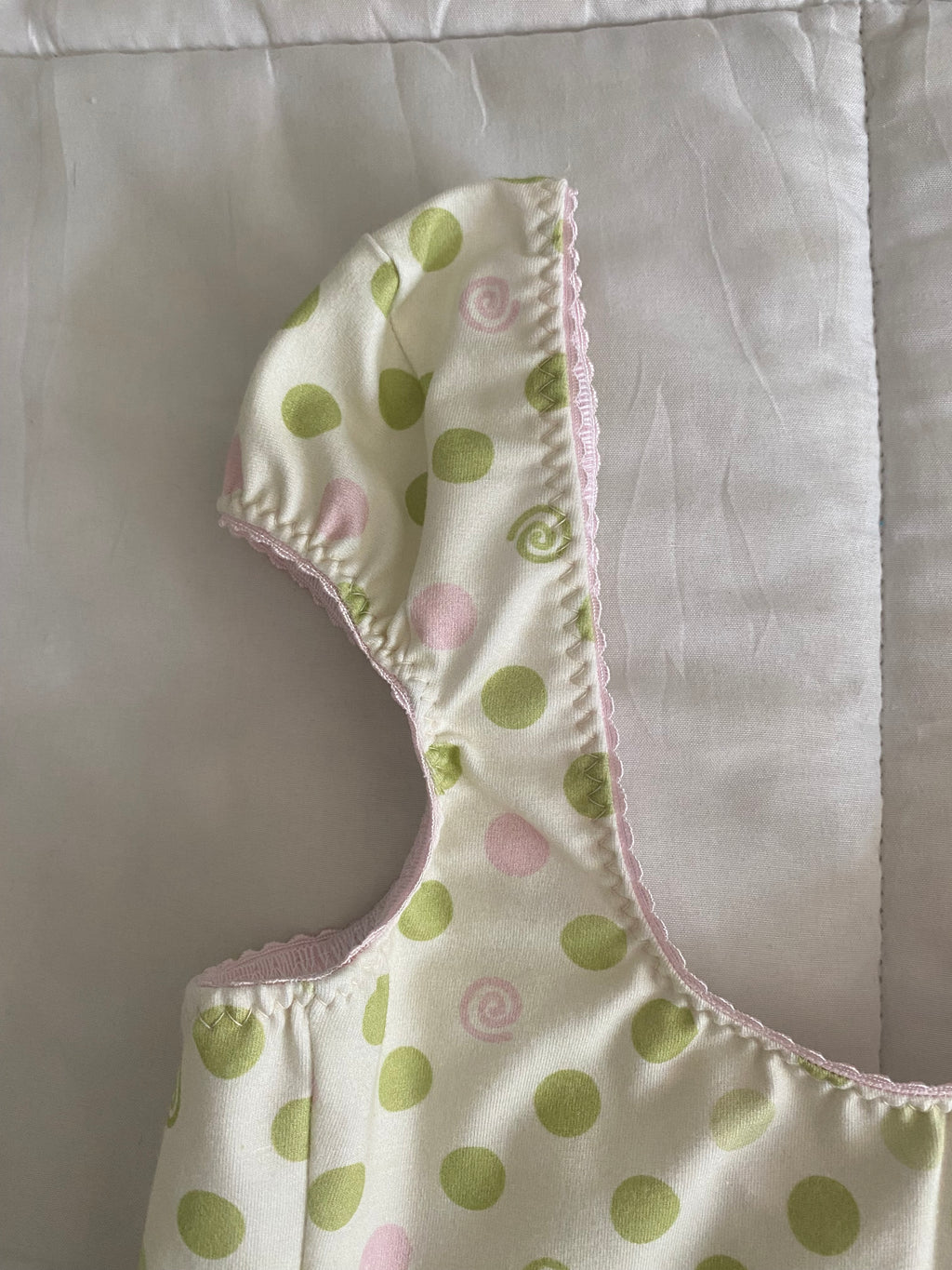 green & pink dotted/swirl top