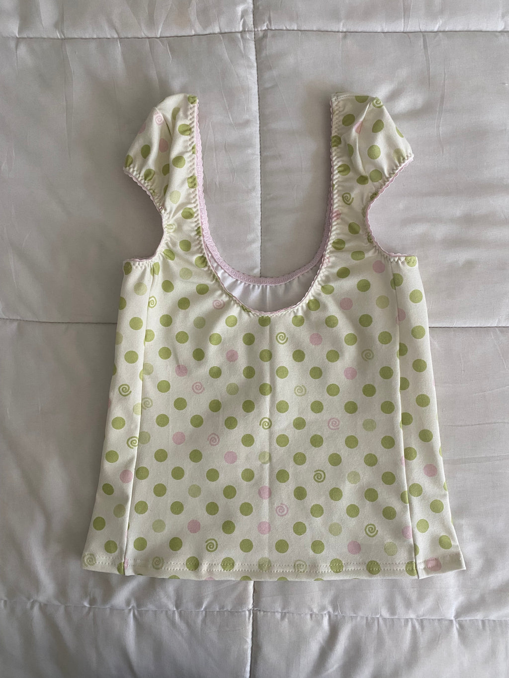 green & pink dotted/swirl top